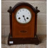 AN ARCHED TOP INLAID MAHOGANY MANTLE CLOCK