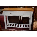 A MODERN PAINTED KITCHEN SIDE TABLE, the rectangular top above two frieze drawers, on square legs,