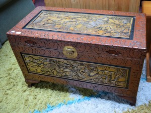 A CARVED AND LACQUERED ORIENTAL LIFT TOP CHEST