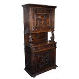 A CARVED 17TH CENTURY STYLE WALNUT AND OAK COURT CUPBOARD