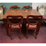 A GEORGIAN STYLE MAHOGANY DINING TABLE