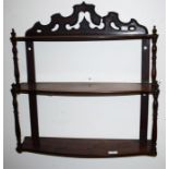 A VICTORIAN THREE TIER SERPENTINE SHAPED WALL BRACKET, with turned pillars, 26'' (66cm)w. (1)