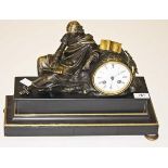 A RECTANGULAR BLACK POLISHED LIMESTONE FRENCH MANTEL CLOCK