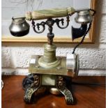 A REPRODUCTION RING DIAL TELEPHONE, with onyx handle, on flip stand. (1)