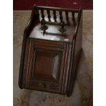 AN EDWARDIAN SLOPE FRONT PANELED OAK COAL SCUTTLE,