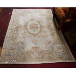 AN AUBUSSON STYLE IVORY GROUND RUG