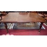 A VICTORIAN MAHOGANY DINING TABLE