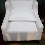 A COMFORTABLE EASY WING ARM CHAIR