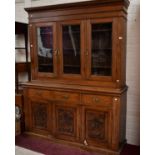 A PINE THREE DOOR BOOKCASE