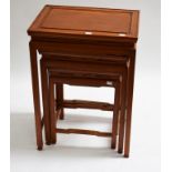 A NEST OF THREE CHINESE HARDWOOD OCCASIONAL TABLES