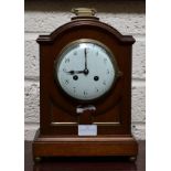 A SMALL REGENCY STYLE BRASS MOUNTED BRACKET CLOCK