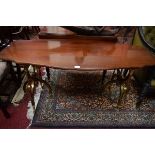 AN UNUSUAL MAHOGANY AND BRASS CENTRE TABLE