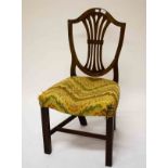 A MATCHED SET OF FOUR GEORGE III PERIOD MAHOGANY SHIELD BACK SIDE CHAIRS