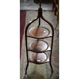 A THREE TIER MAHOGANY CAKE STAND