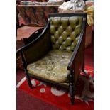 A PAIR OF GEORGE IV STYLE EBONISED LIBRARY ARM CHAIRS