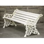 A PAIR OF VERY HEAVY CAST IRON GARDEN BENCHES