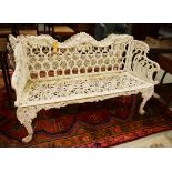 A PAIR OF HEAVY WHITE PAINTED CAST IRON GARDEN BENCHES