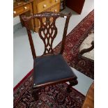 AN ATTRACTIVE SET OF TEN CHIPPENDALE STYLE MAHOGANY DINING CHAIRS