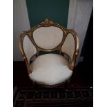 AN ATTRACTIVE PAIR OF LOUIS XV STYLE MOULDED GILT OCCASIONAL ARMCHAIRS