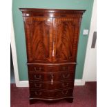 A GEORGE III STYLE SERPENTINE FRONTED MAHOGANY COCKTAIL CABINET