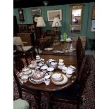 A REGENCY STYLE TRIPLE PEDESTAL MAHOGANY DINING TABLE,