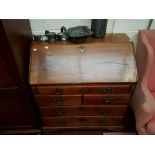 A GEORGIAN MAHOGANY SLOPE FRONT BUREAU