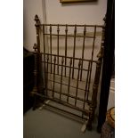 AN OLD CAST IRON BED