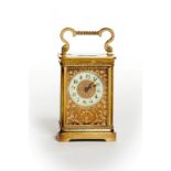 AN ATTRACTIVE FRENCH BRASS CARRIAGE CLOCK