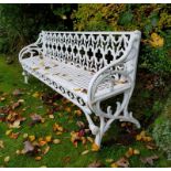 A VERY HEAVY PAIR OF WHITE PAINTED GOTHIC STYLE GARDEN BENCHES