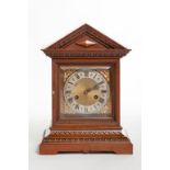 AN OAK CASED BRACKET CLOCK