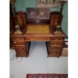 A VICTORIAN DICKENS-TYPE WALNUT PEDESTAL WRITING DESK