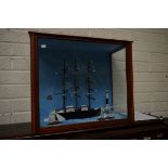 A CASED SCALE MODEL OF A SHIP