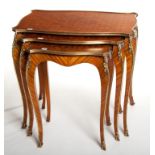 A VERY FINE NEST OF THREE FRENCH BRASS-MOUNTED PARQUETRY OCCASIONAL TABLES