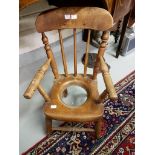 AN OLD CHILD'S ELM AND ASH TOILET TRAINING ARMCHAIR