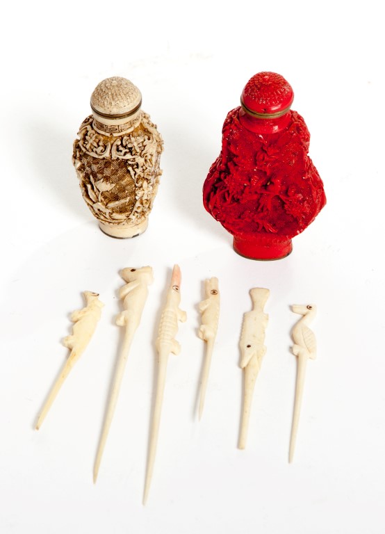 A COLLECTION OF ANIMAL FORM BONE OR IVORY TOOTHPICKS