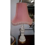 A PAIR OF COMPOSITION FAUX PORCELAIN RELIEF MOULDED TABLE LAMPS