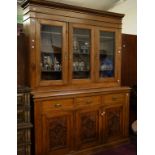 A PINE THREE-DOOR BOOKCASE