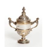 A SILVER AND SILVER GILT TWO-HANDLED CUP AND COVER