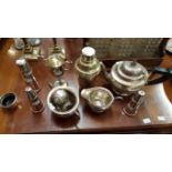 A THREE-PIECE INDIAN WHITE METAL TEA SERVICE