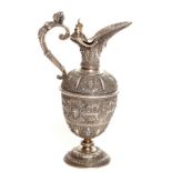 AN UNUSUAL NINETEENTH ENGLISH CHASED AND SILVER-PLATE TROPHY EWER