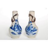 A PAIR OF NINETEENTH CENTURY CHINESE BLUE AND WHITE CRACKLEWARE BOTTLE FORM VASES