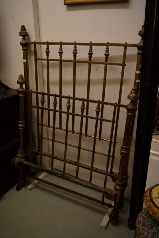 AN OLD CAST IRON BED