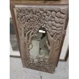 A CARVED WOODEN MIRROR FRAME