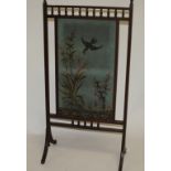 AN EDWARDIAN MAHOGANY CHEVAL FIRE SCREEN