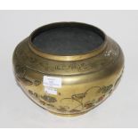 A CHINESE BRASS AND COPPER MOUNTED RELIEF MOULDED BOWL