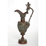 A HEAVY RELIEF CAST BRONZE EWER