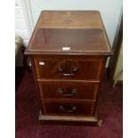 AN INLAID AND CROSS-BANDED MAHOGANY THREE DRAWER PEDESTAL