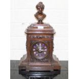 A CARVED FRENCH WALNUT-CASED BRACKET CLOCK