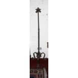 AN UNUSUAL CAST METAL AND WROUGHT IRON STANDARD LAMP