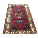 AN ORIENTAL RUG